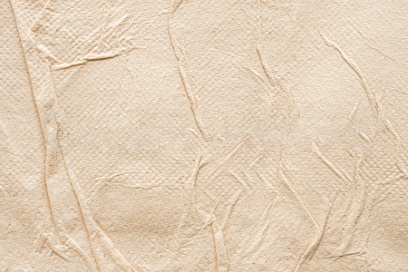 Crumpled brown recycle tissue paper texture abstract backgroundの写真素材