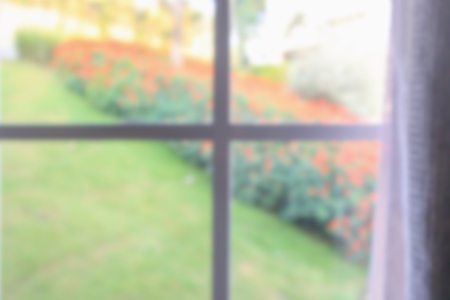 window curtain with green garden abstract blur background