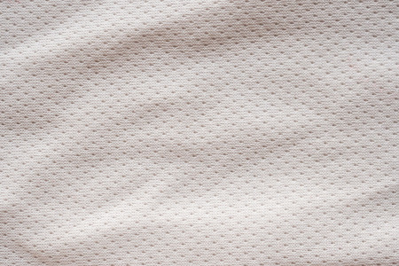 White fabric sport clothing football jersey with air mesh texture background