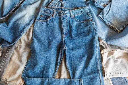many denim blue jeans background