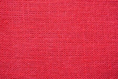 Red color linen canvas texture backgroundの写真素材
