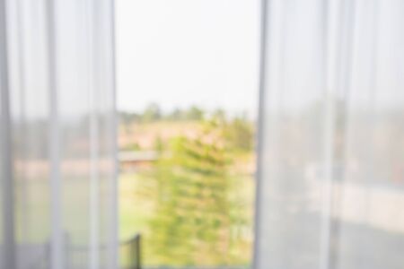 window curtain with green garden abstract blur backgroundの写真素材