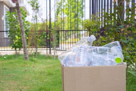 plastic bottles in brown recycle garbage box