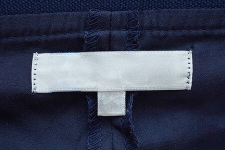 Blank white clothes label close up