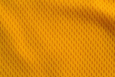 Orange color sports clothing fabric jersey football shirt texture top viewの写真素材
