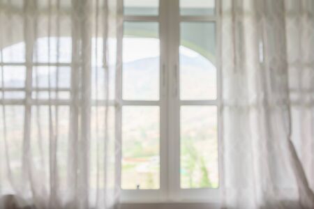 window curtain with green garden abstract blur backgroundの写真素材