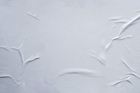 Blank white crumpled and creased paper poster texture backgroundの写真素材
