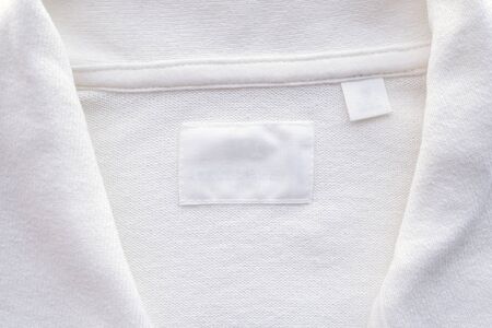 Blank white clothes label on new shirt backgroundの写真素材