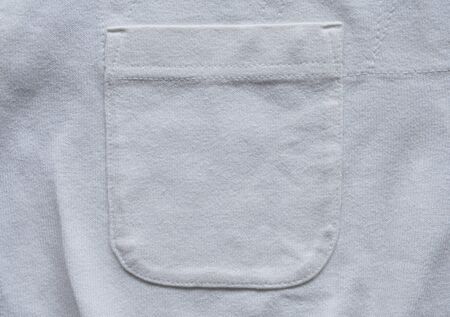 closeup pocket on white cotton shirtの写真素材