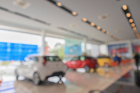 new cars in showroom blurred defocused background