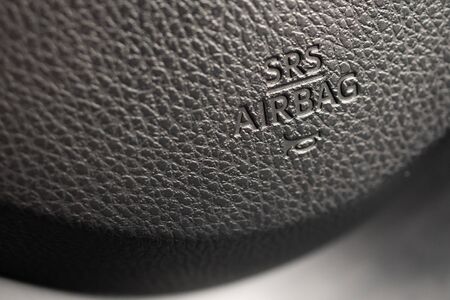 Safety airbag sign on car steering wheel with horn icon