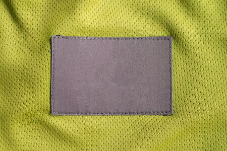 laundry care clothing label patch on polyester fabric jersey sport textureの写真素材