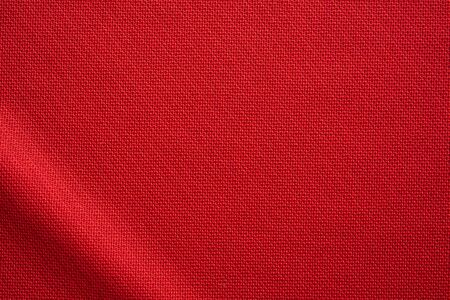 Red sports clothing fabric football jersey texture close upの写真素材