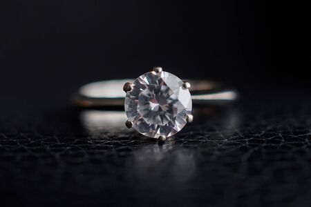 Close up diamond ring jewelry on black leather backgroundの写真素材