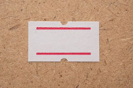 White paper sticker price on wooden background
