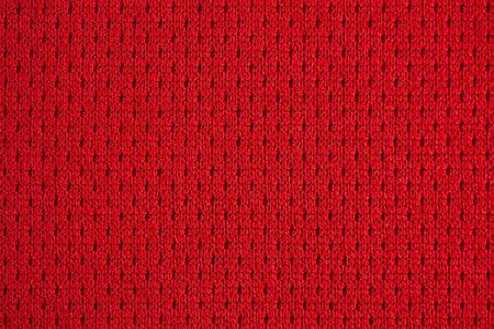 Red sports clothing fabric football jersey texture close upの写真素材