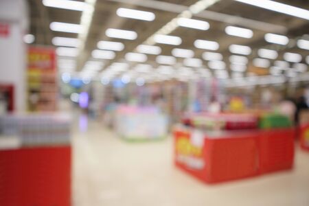 Abstract supermarket grocery store blurred defocused background with bokeh lightの写真素材
