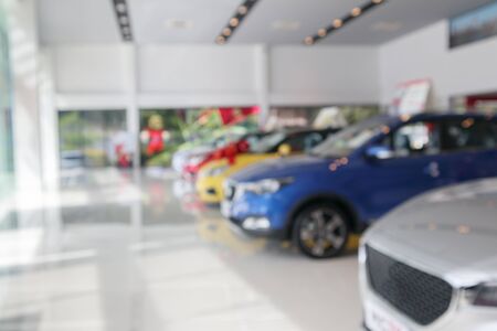 new cars in showroom blurred defocused backgroundの写真素材