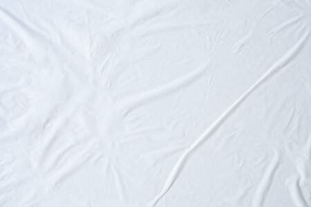 Blank white crumpled and creased paper poster texture backgroundの写真素材