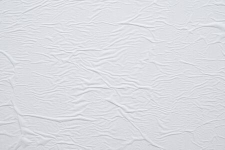 Blank white crumpled and creased paper poster texture background