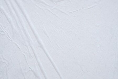 Blank white crumpled and creased paper poster texture background