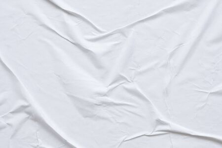 Blank white crumpled and creased paper poster texture backgroundの写真素材
