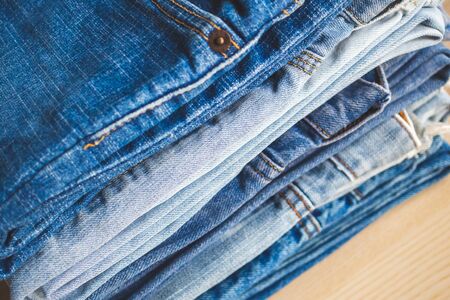 denim blue jeans stack texture background closeup