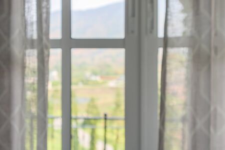 window curtain with green garden abstract blur backgroundの写真素材