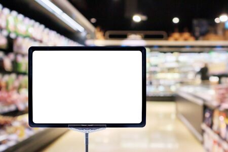 Mock up blank price board poster sign display with supermarket aisle abstract backgroundの写真素材