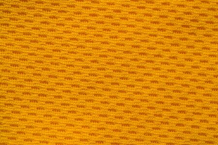 Orange color sports clothing fabric jersey football shirt texture top view