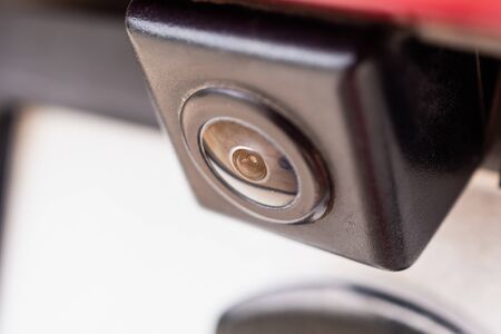 Red car rear view camera close up for parking assistanceの写真素材