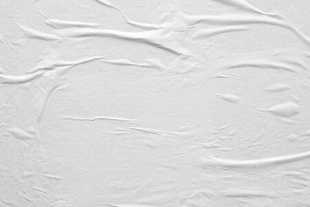 Blank white crumpled and creased paper poster texture backgroundの写真素材