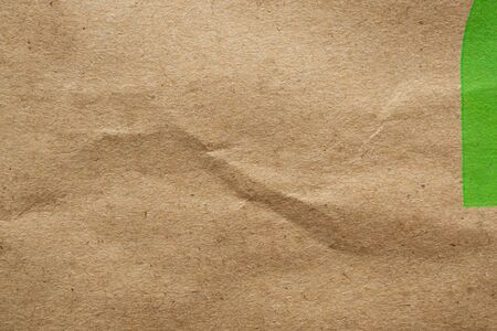 Brown crumpled paper recycled kraft sheet texture background