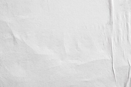 Blank white crumpled and creased paper poster texture backgroundの写真素材