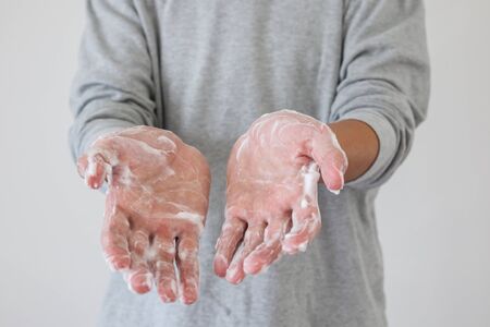 Man wash hands with soap for COVID-19 corona virus prevention concept
