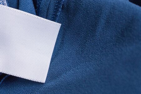 laundry care clothing label on blue dressの写真素材