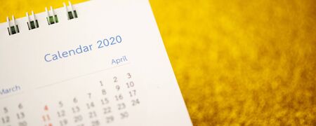 Happy new year 2020 calendar page close up on gold glitter sparkle backgroundの写真素材