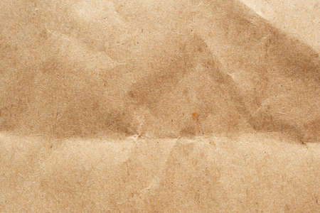 Brown crumpled paper recycled kraft sheet texture background
