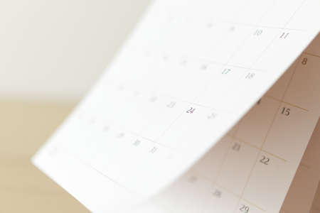 Calendar page flipping sheet close up blur background business schedule planning appointment meeting conceptの写真素材