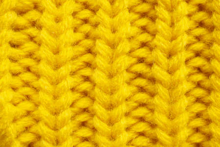 Yellow knitting wool texture backgroundの写真素材