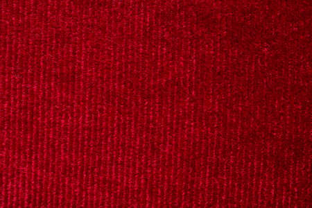 Red fabric cloth texture background close up