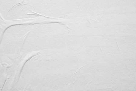 Blank white crumpled and creased paper poster texture backgroundの写真素材