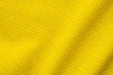 Yellow sports clothing fabric football shirt jersey texture close upの写真素材