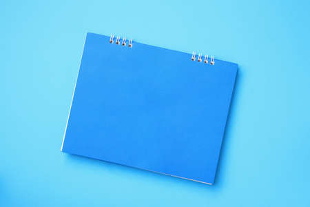 Empty blank calendar on blue backgroundの写真素材
