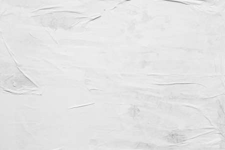 Blank white crumpled and creased paper poster texture backgroundの写真素材