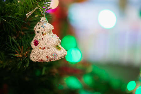 Decorated Christmas baubles on fir tree New Year holidays background