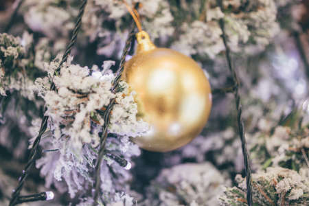 Decorated Christmas ball on fir tree New Year holidays background