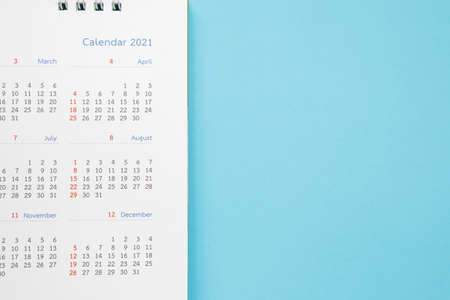 2021 calendar page on blue background business planning appointment meeting conceptの写真素材