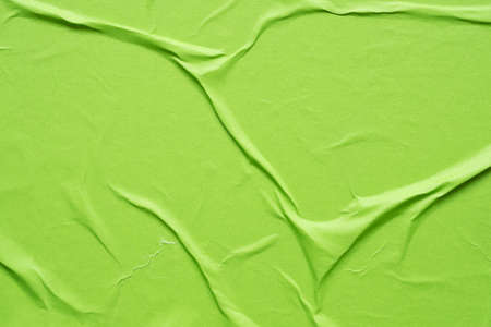 green crumpled and creased paper poster texture backgroundの写真素材