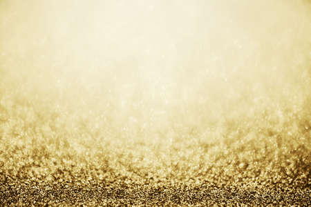 Abstract gold glitter sparkle blurred with bokeh background